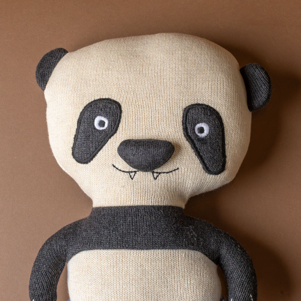 ling-ling-panda-bear Stuffed panda toy with a plain background