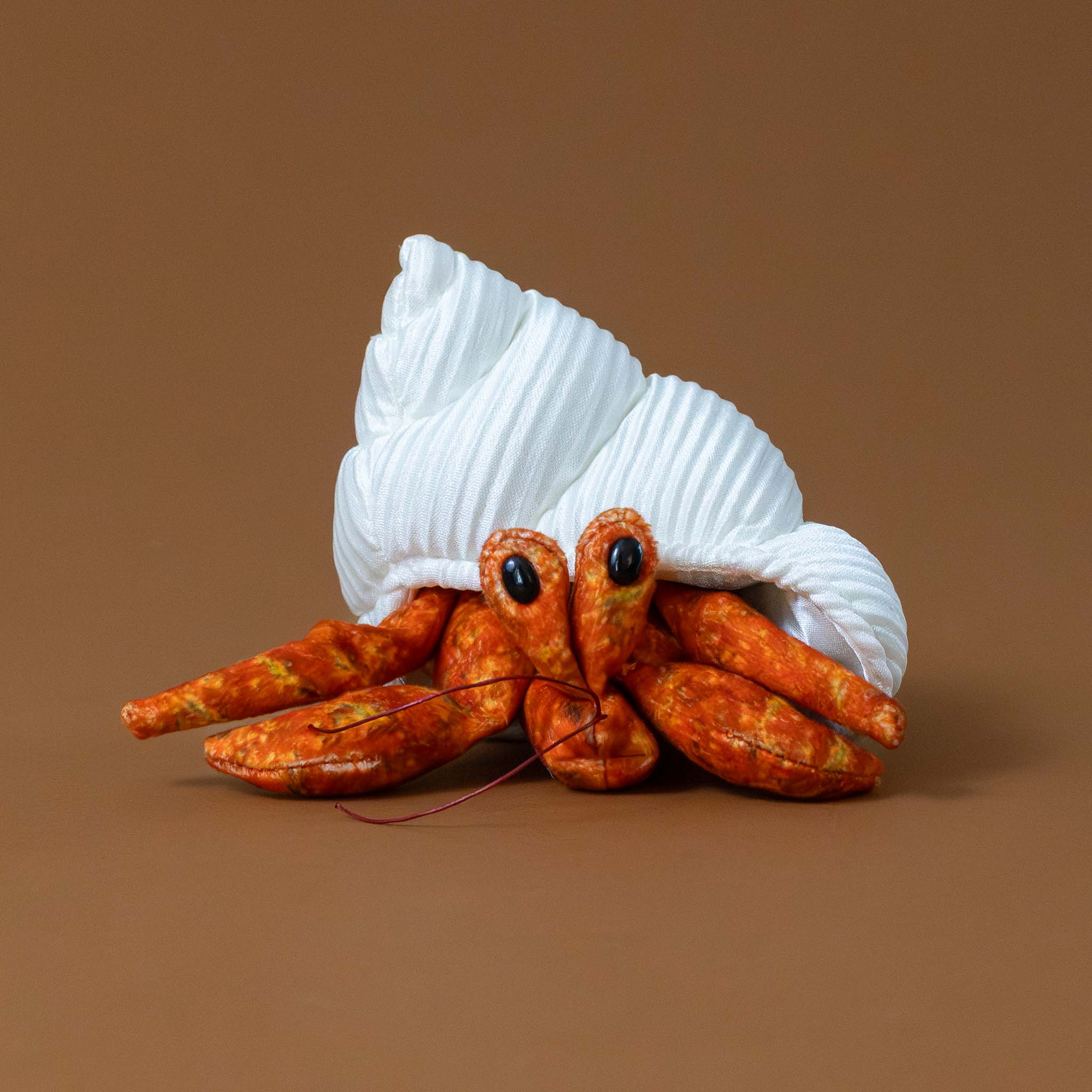 little-orange-hermit-crab-finger-puppet-with-white-corded-shell