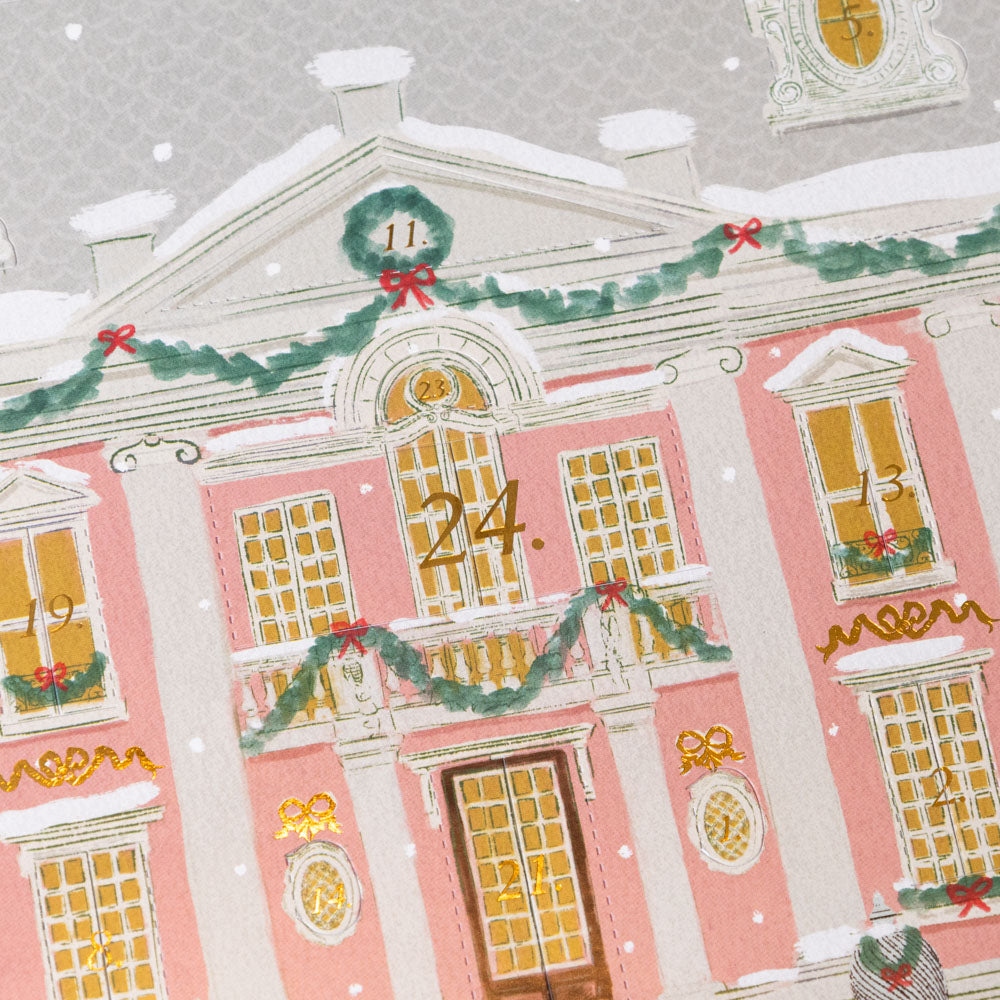magical-holiday-night-advent-calendar Decorative building facade with Christmas decorations on a light gray background