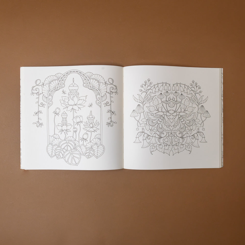 magical-worlds-coloring-book Open book with intricate line drawings on a brown background