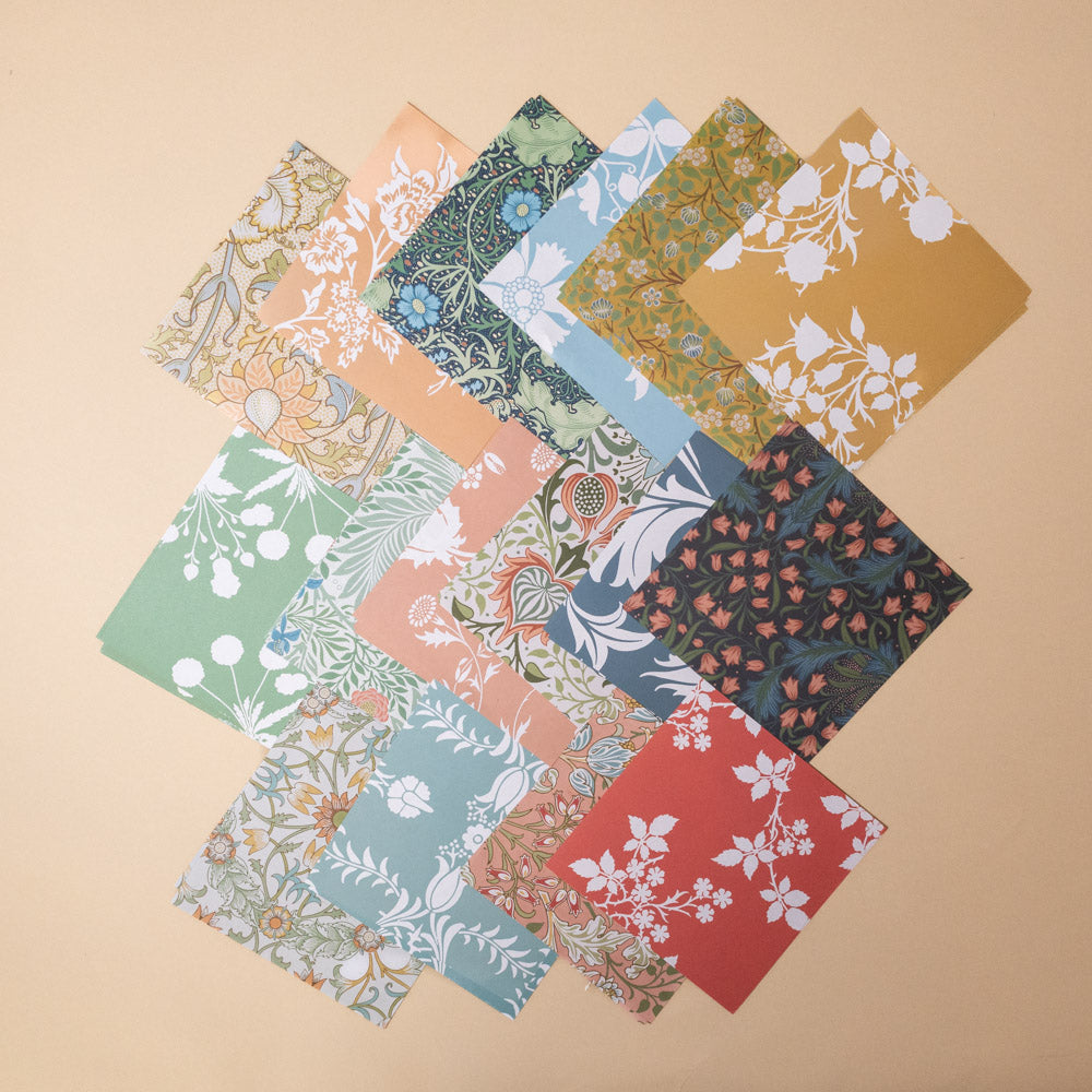 make-your-own-william-morris-florals-origami-kit Collection of floral fabric origami paper arranged in a pattern on a beige background