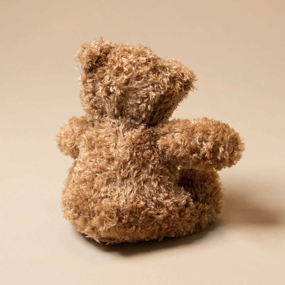martin-bear-petite Brown teddy bear back on a beige background