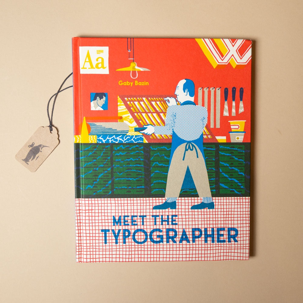 Book titled 'Meet the Typographer' with colorful cover design on a beige background