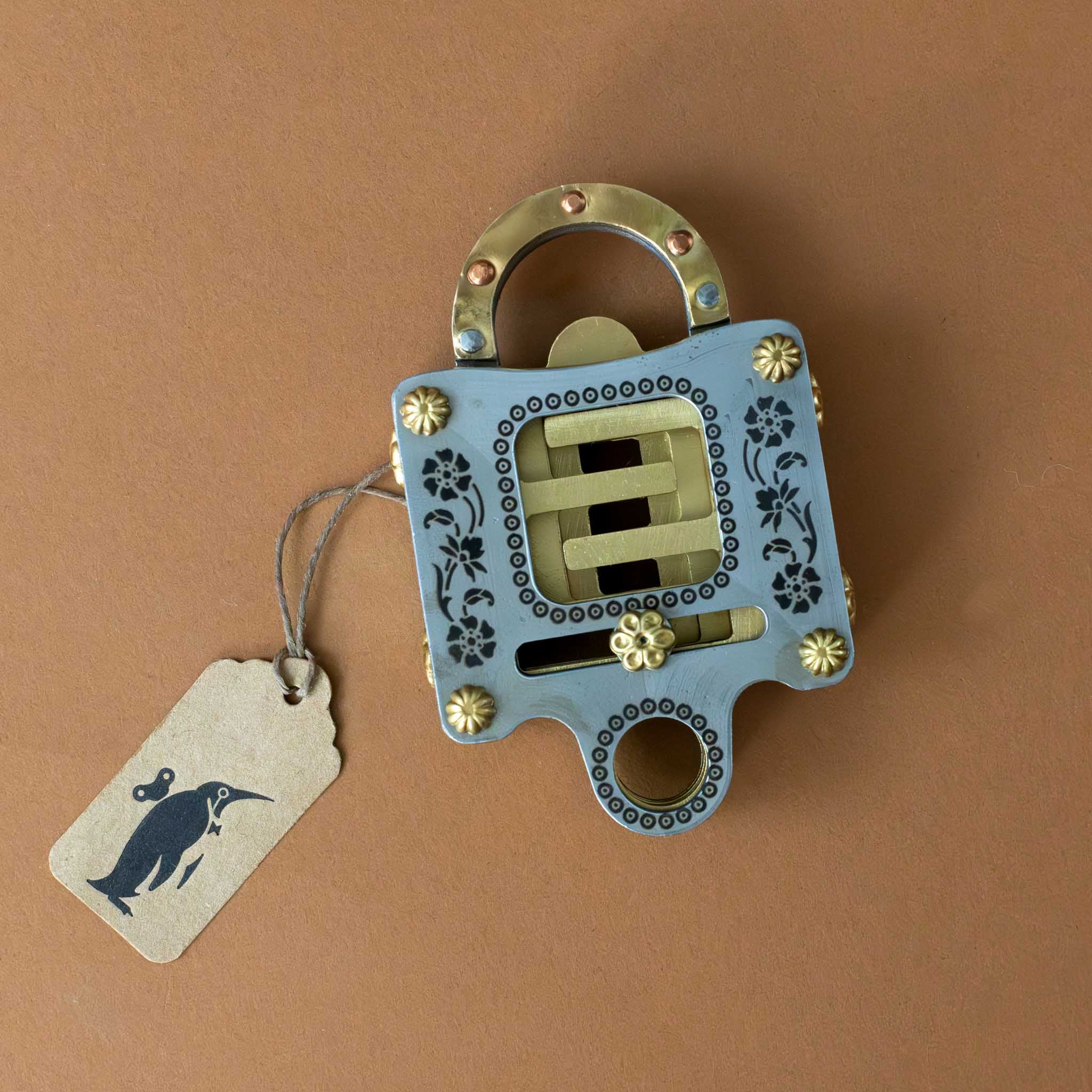 metal-un-locking-puzzle-brass-and-silver-colored-with-floral-detail