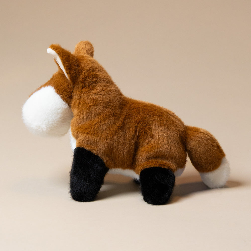 muzzle-frankie-fox-large Plush toy fox on a beige background