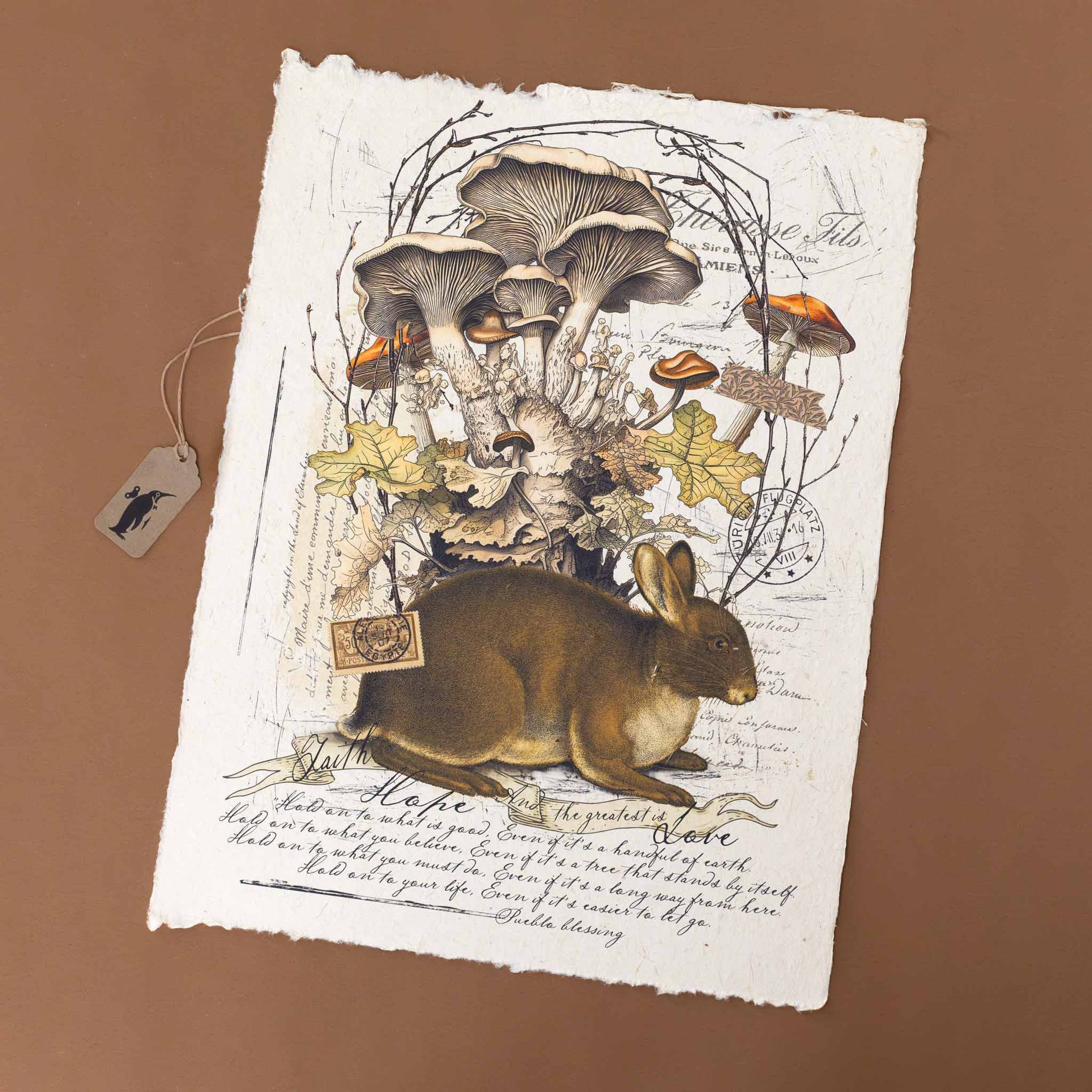 paper-print-faith-hope-and-the-greatest-is-love-quote-with-hare-mushrooms-leaves-and-frame-of-twigs-along-with-script-underlyning