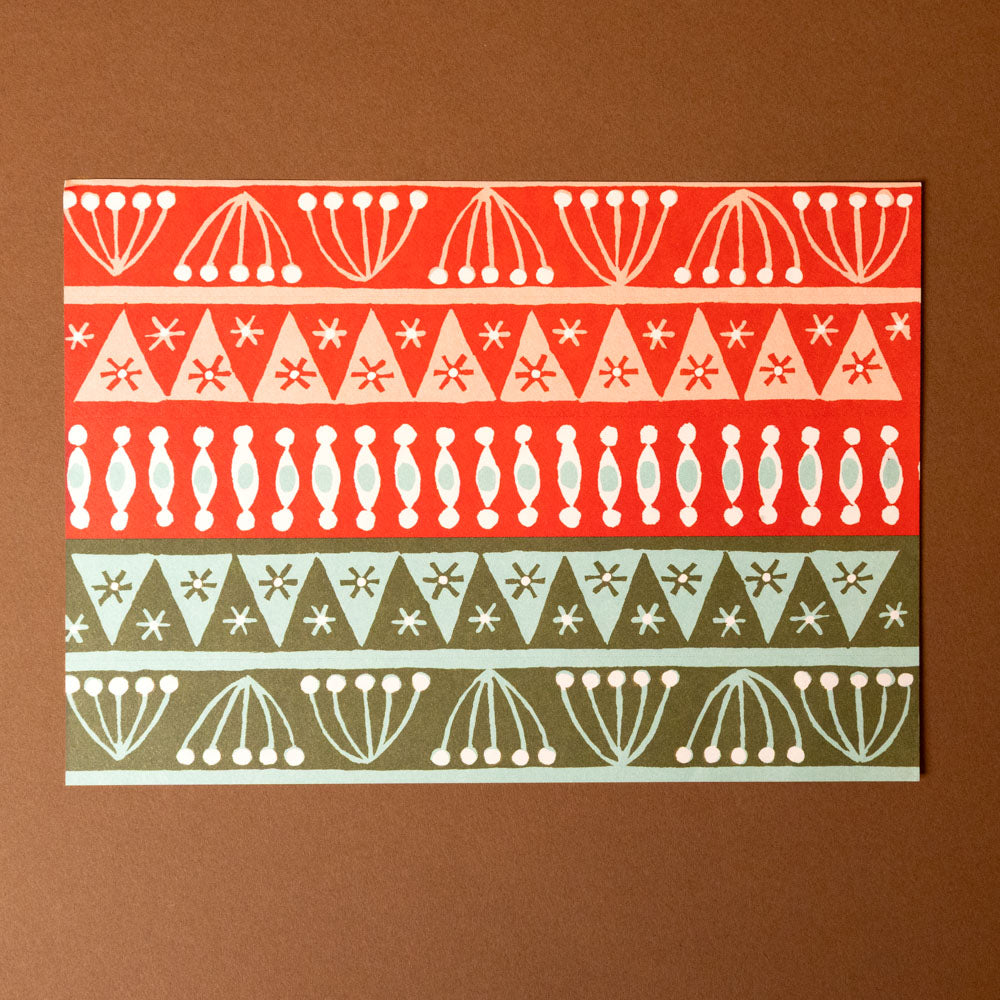 Patterned card with geometric design on a brown background
