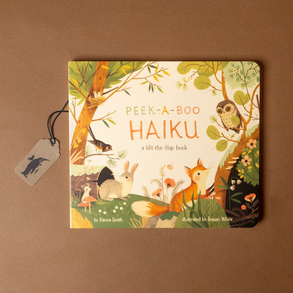Children's book titled 'Peek-a-Boo Haiku' with forest animals illustration on a brown background