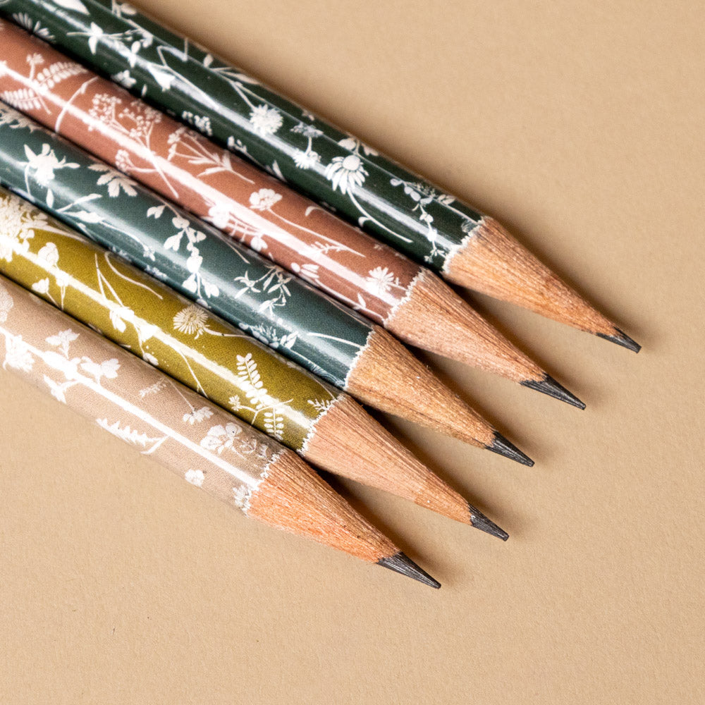pencil-terrarium-element Set of pencils tips with floral designs on a beige background
