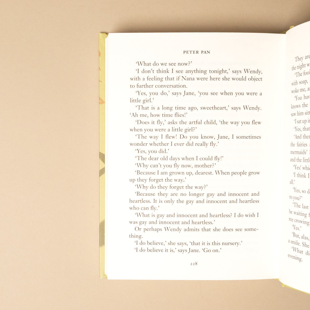 peter-pan Open book with text on a beige background