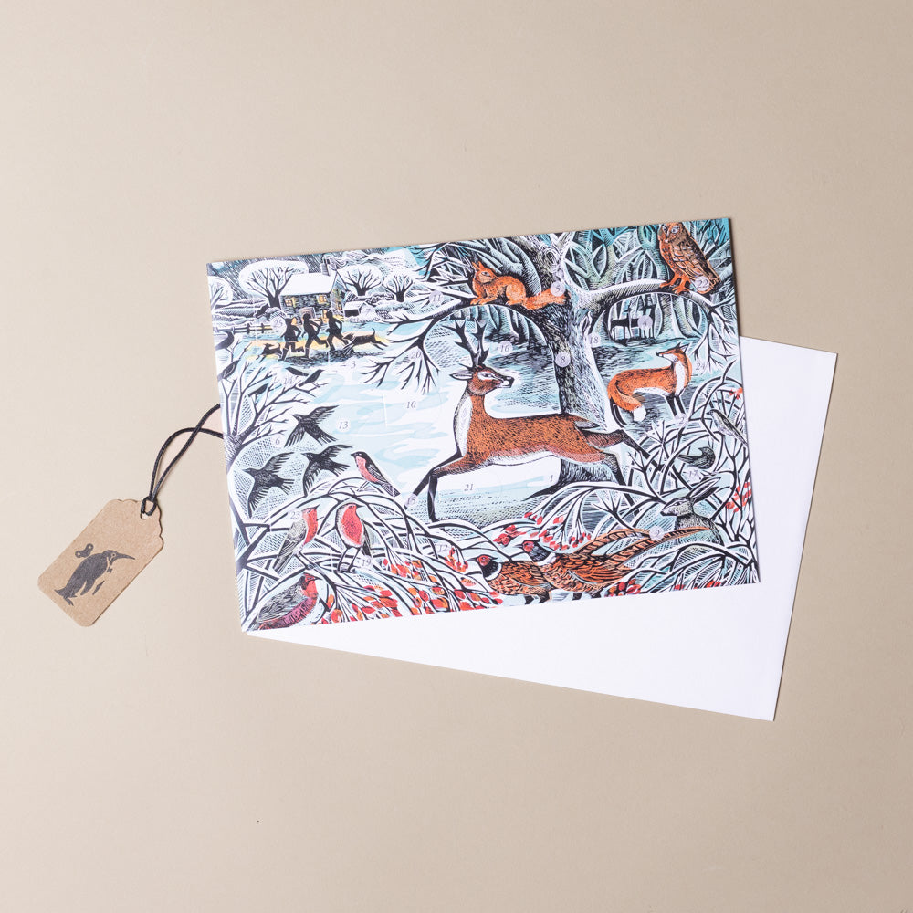 petit-advent-calendarwinter-woodland Greeting card with deer and bird design on a beige background