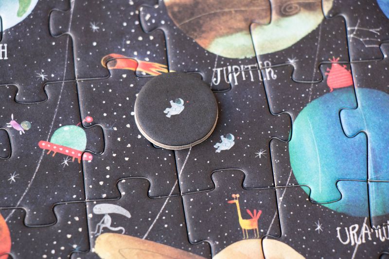 petite-24-piece-observation-puzzle-planets Jigsaw puzzle with space-themed design featuring planets and celestial bodies and astronaut observation piece