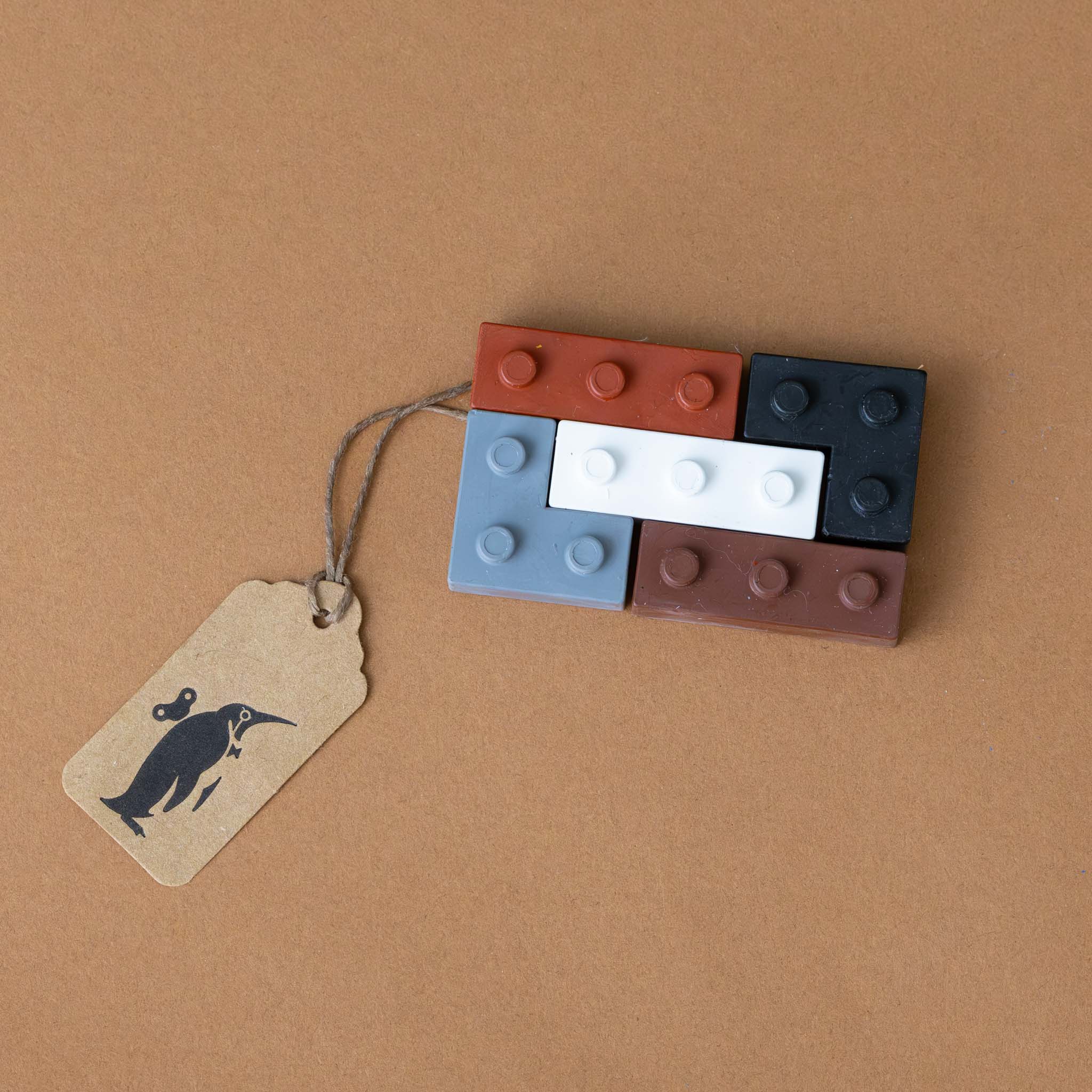 pocket-5-crayons-warm-grey-shaped-like-building-blocks-in-grey-black-and-browns