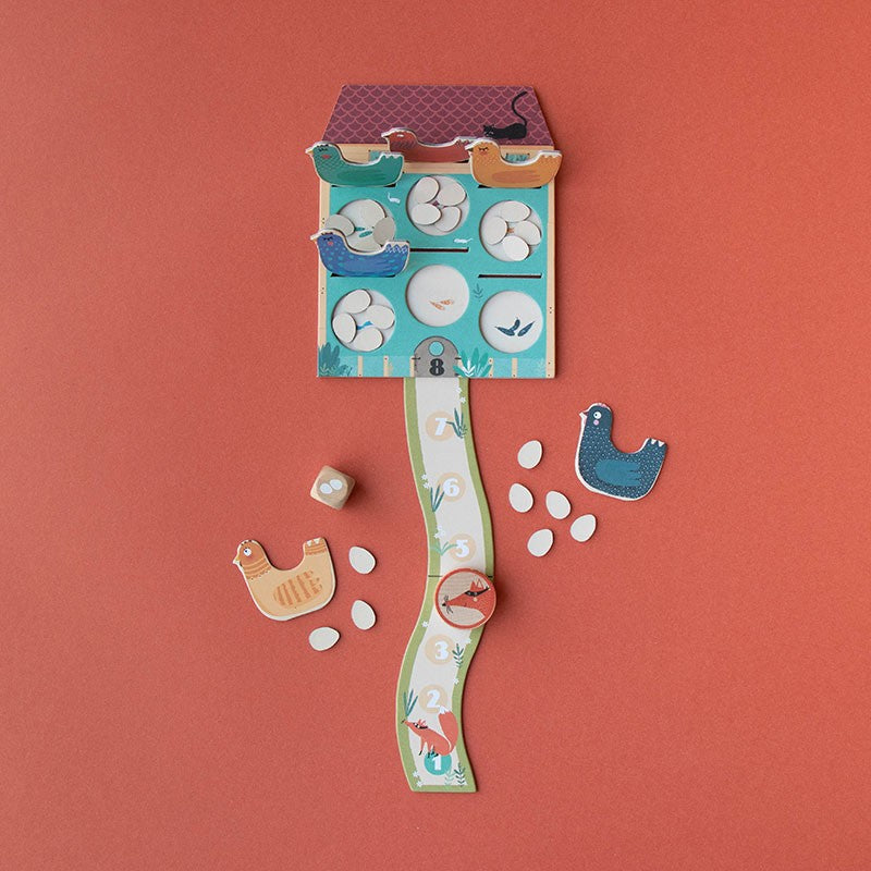 pocket-game-cluck-cluck-the-fox Children's puzzle with animal-themed pieces on a red background