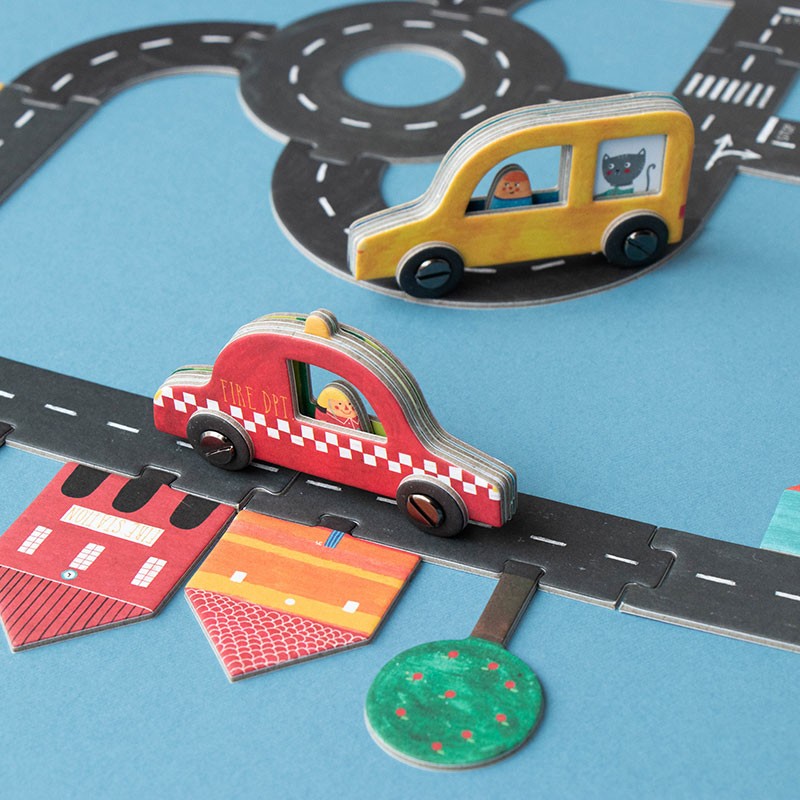 pocket-game-roads Toy cars on a road track with colorful buildings and a blue background