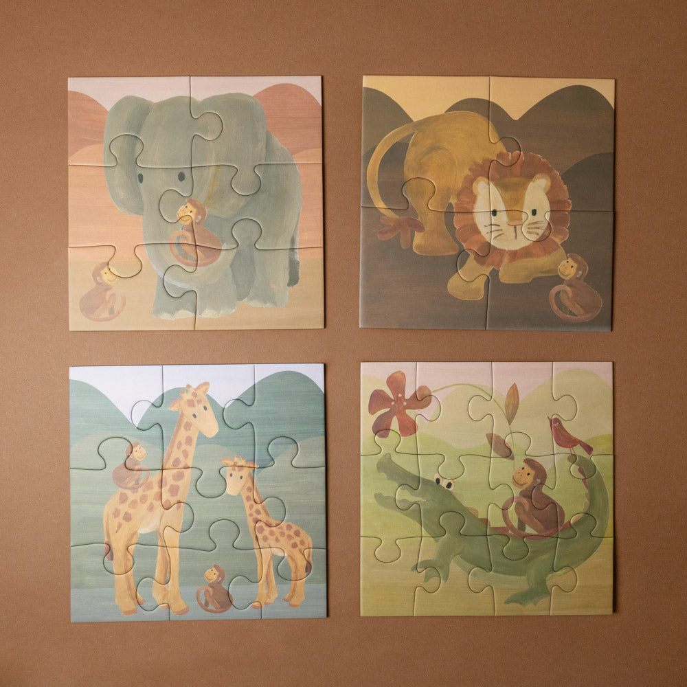 progressive-puzzle-set-african-savanna Four animal-themed children's puzzles on a brown background