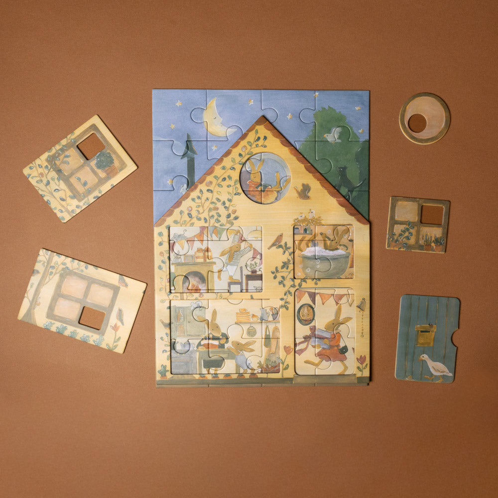 rabbit-family-house-puzzle Children's puzzle with a house design on a brown background