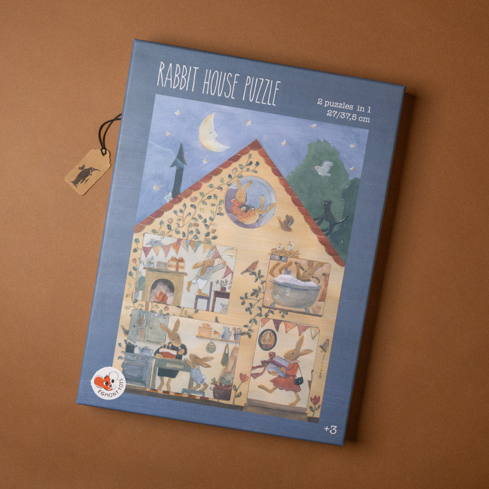 Rabbit House Puzzle packaging on a brown background