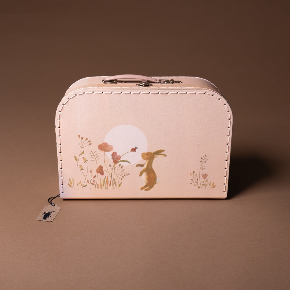 rabbit-family-suitcase-large Pink suitcase with rabbit and floral design on a brown background