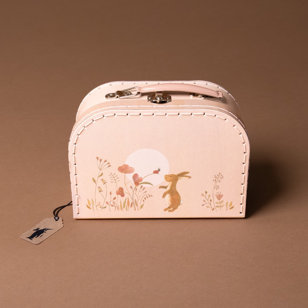 rabbit-family-suitcase-small Small pink suitcase with rabbit and floral design on a brown background