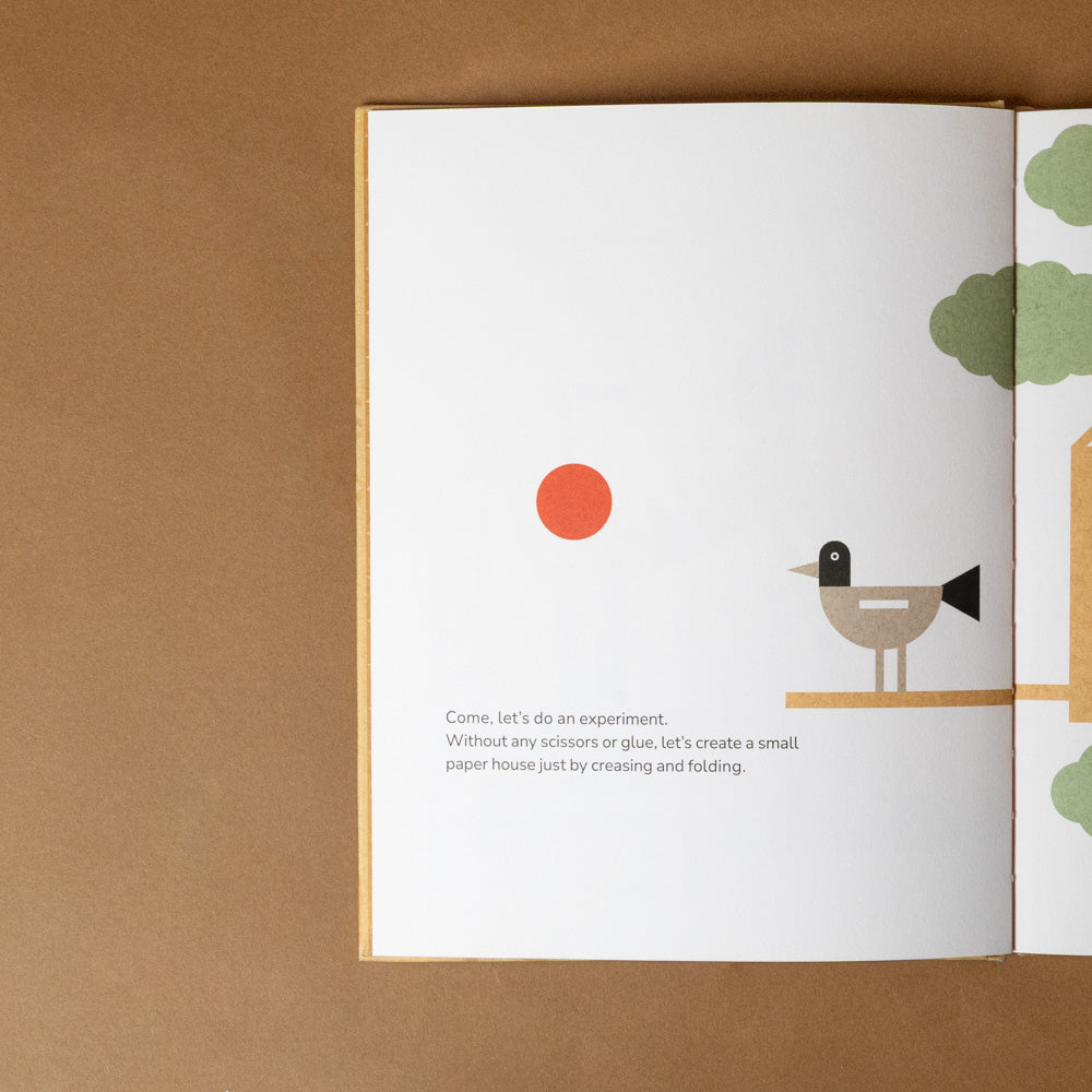 shigeru-ban-build-a-better-world Open book with illustrations of a sun, bird, and tree on a brown background