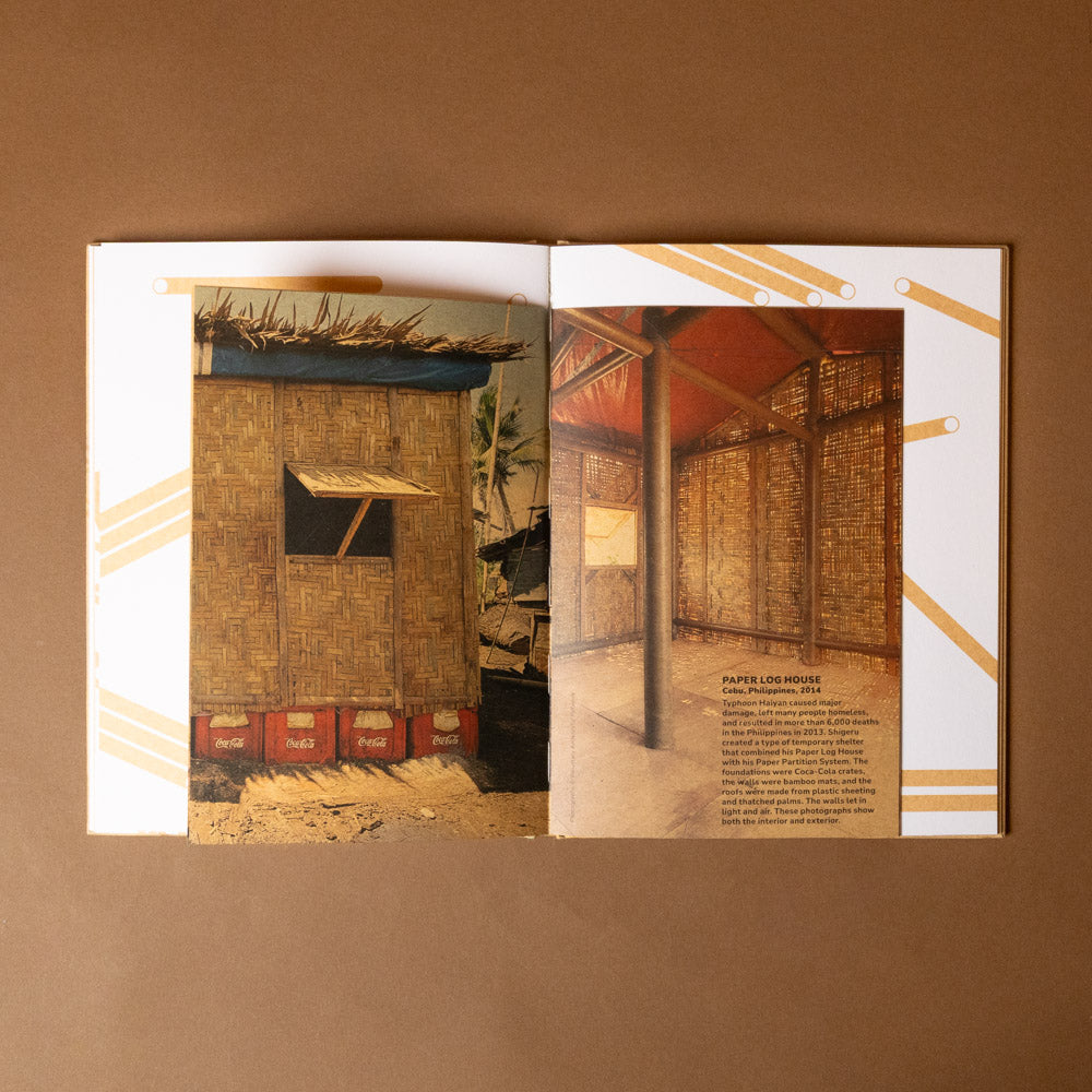 shigeru-ban-build-a-better-world Open book showing two images of rustic interiors with wooden walls and thatched roofs on a brown background.