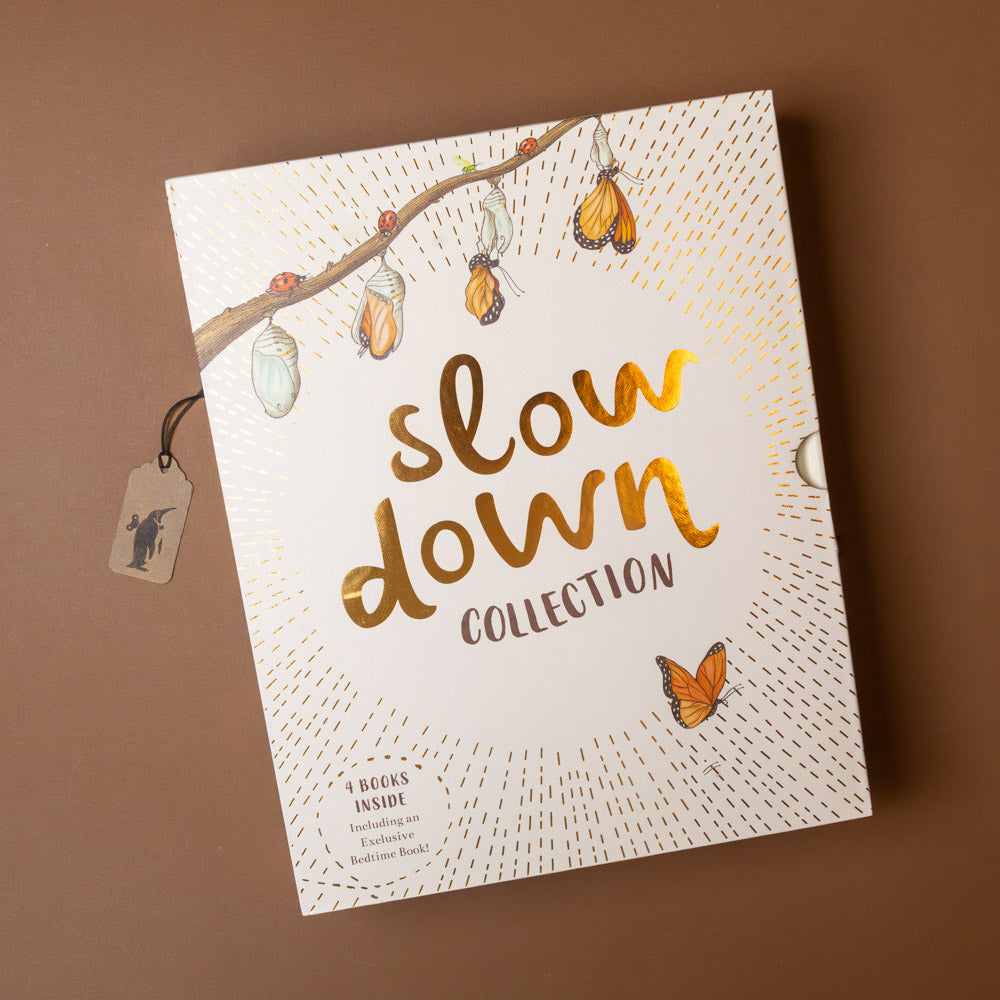 box of Book stitled 'Slow Down Collection' with butterfly illustrations on a brown background