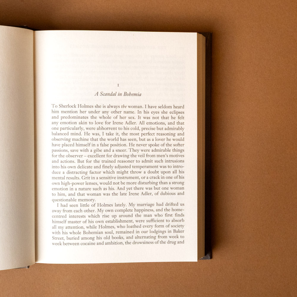 the-adventures-of-sherlock-holmes Open book with text on a brown background