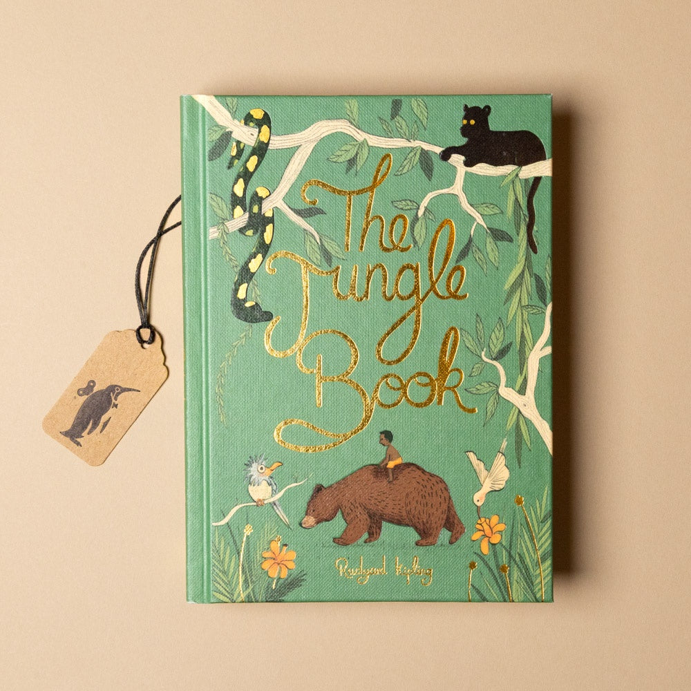 Book titled 'The Jungle Book' with illustrations on a beige background