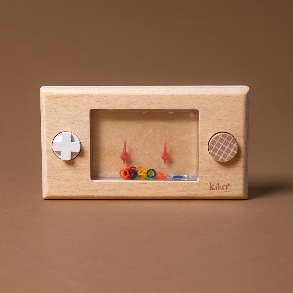 Wooden toy with colorful components on a brown background