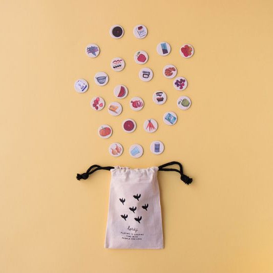 wheres-the-cheese-observation-game-pocket-game Small drawstring bag with printed designs on a beige background