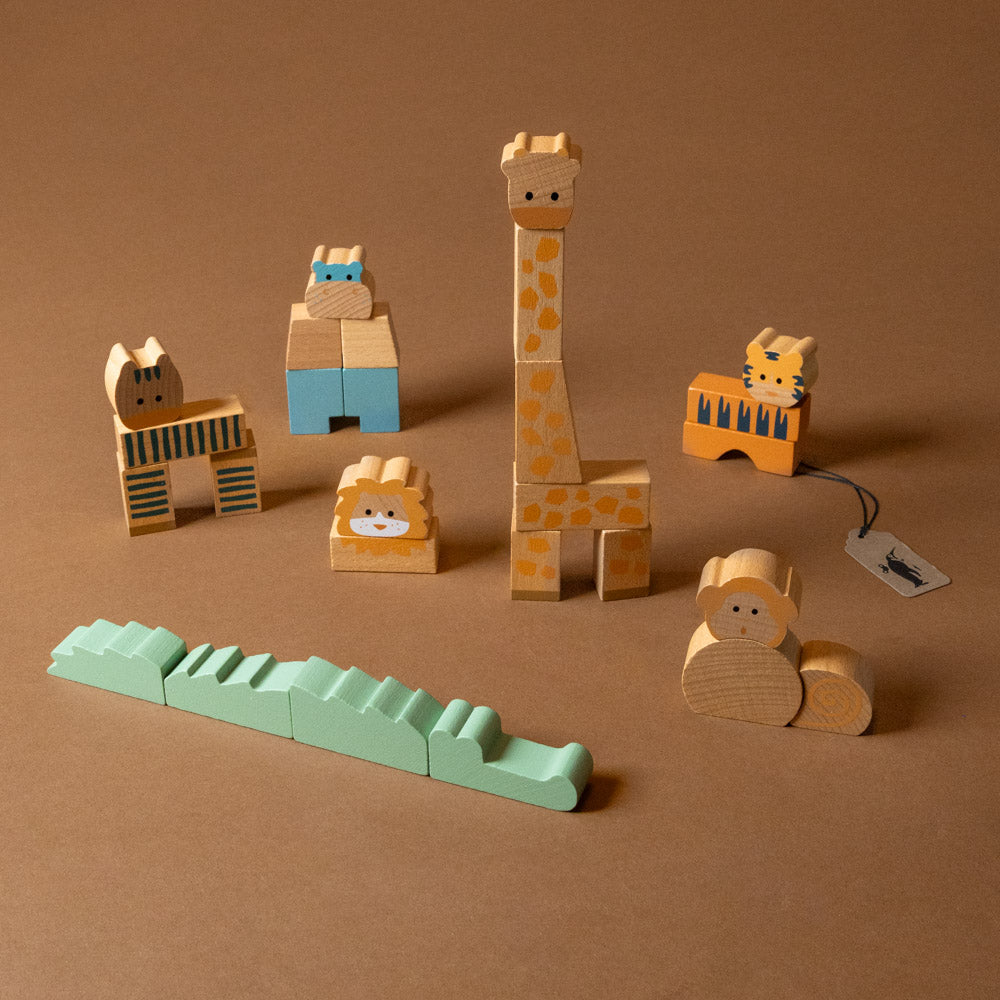 wooden-stacking-block-animals-jungle Set of wooden animal toys on a brown background