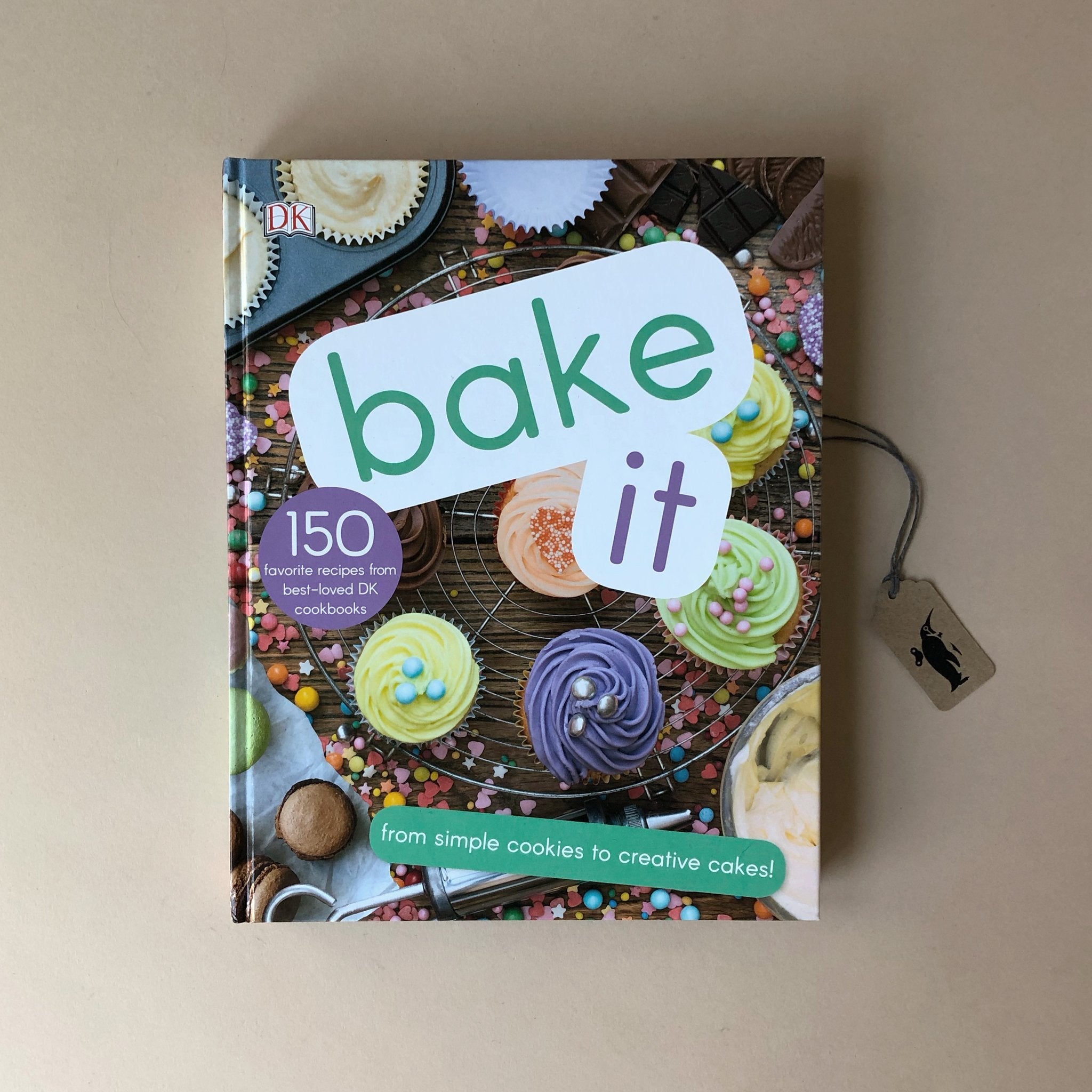 bake-it-cook-book-150-recipes-front-cover-photo-of-iced-cupcakes