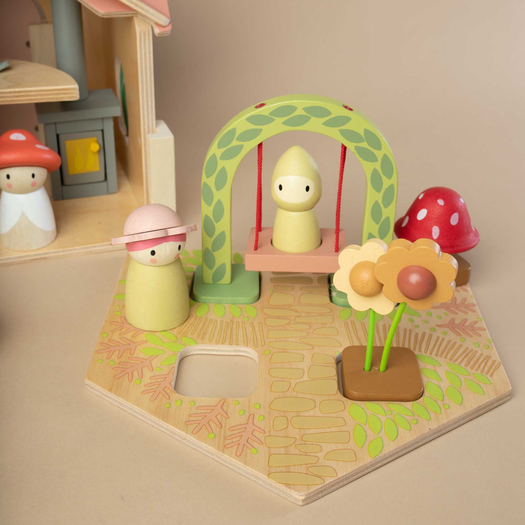 detail-of-mother-and-child-playing-outside-on-the-swing